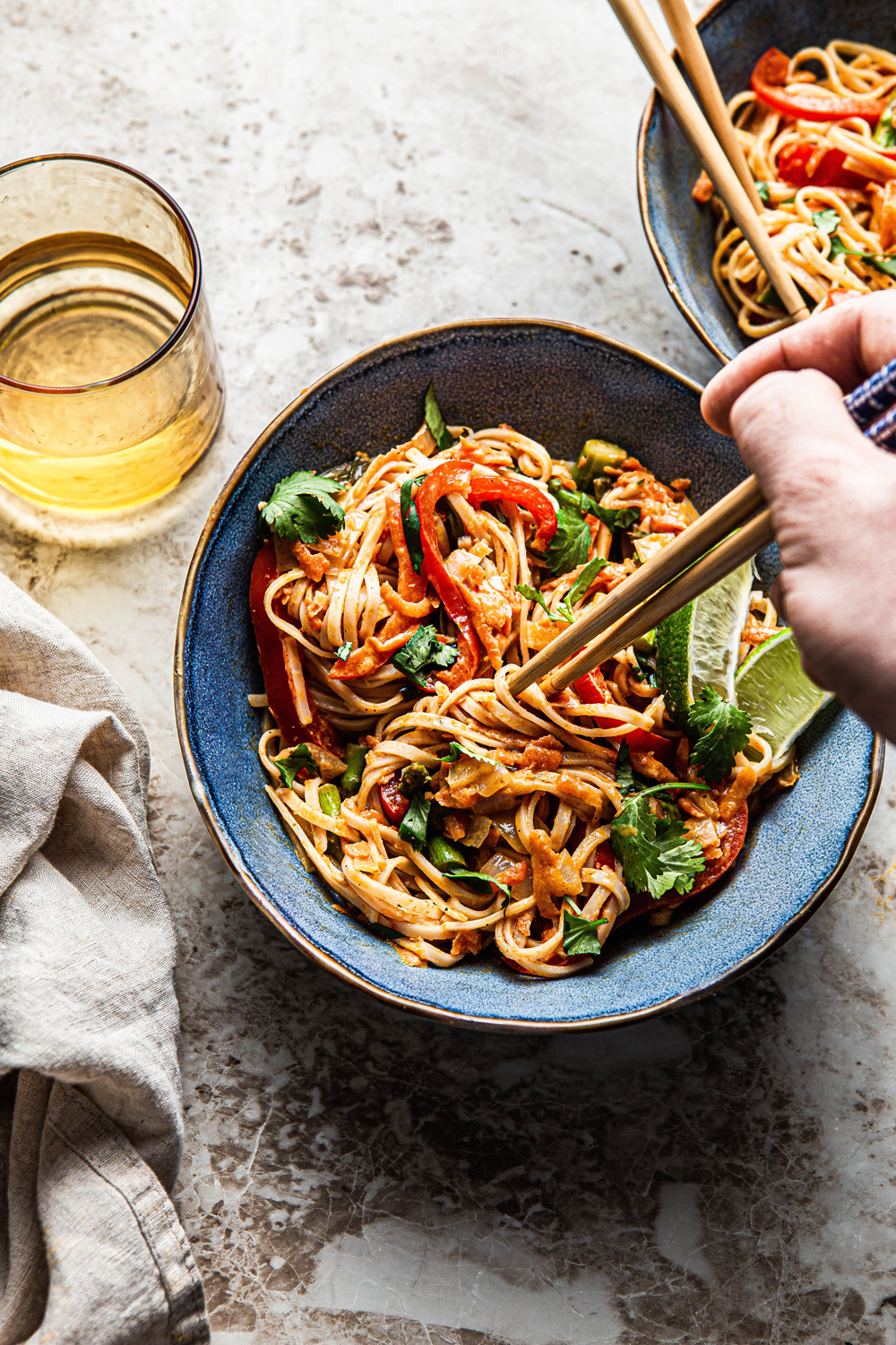 thai red curry noodles with chopsticks photography