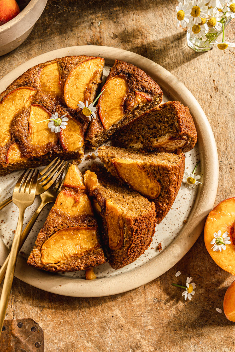 paleo almond flour peach cake with chamomile flowers photography
