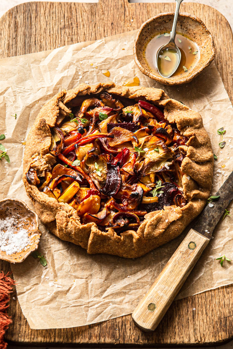 rustic galette with vegetables on a wooden board food photography