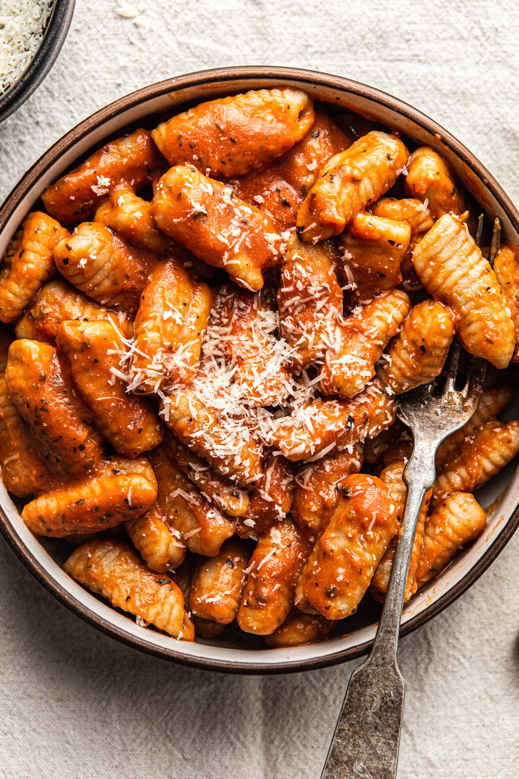 homemade cavatelli pasta ith tomato sauce and parmesan