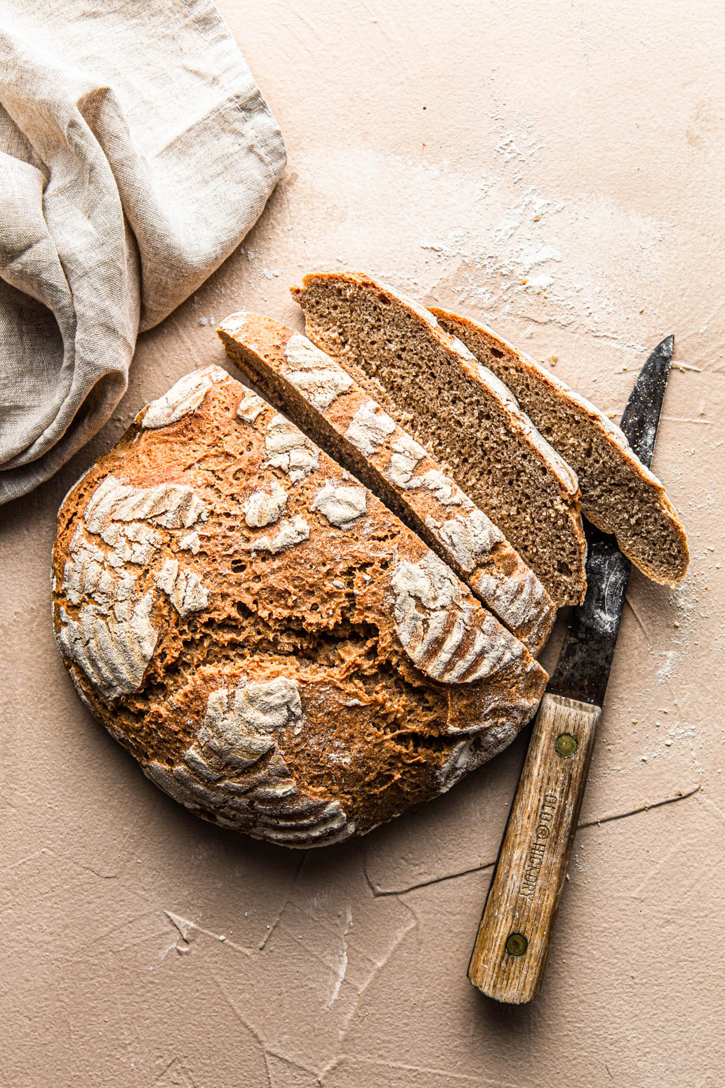 homemade Simple Artisan Bread sliced with vintage knife
