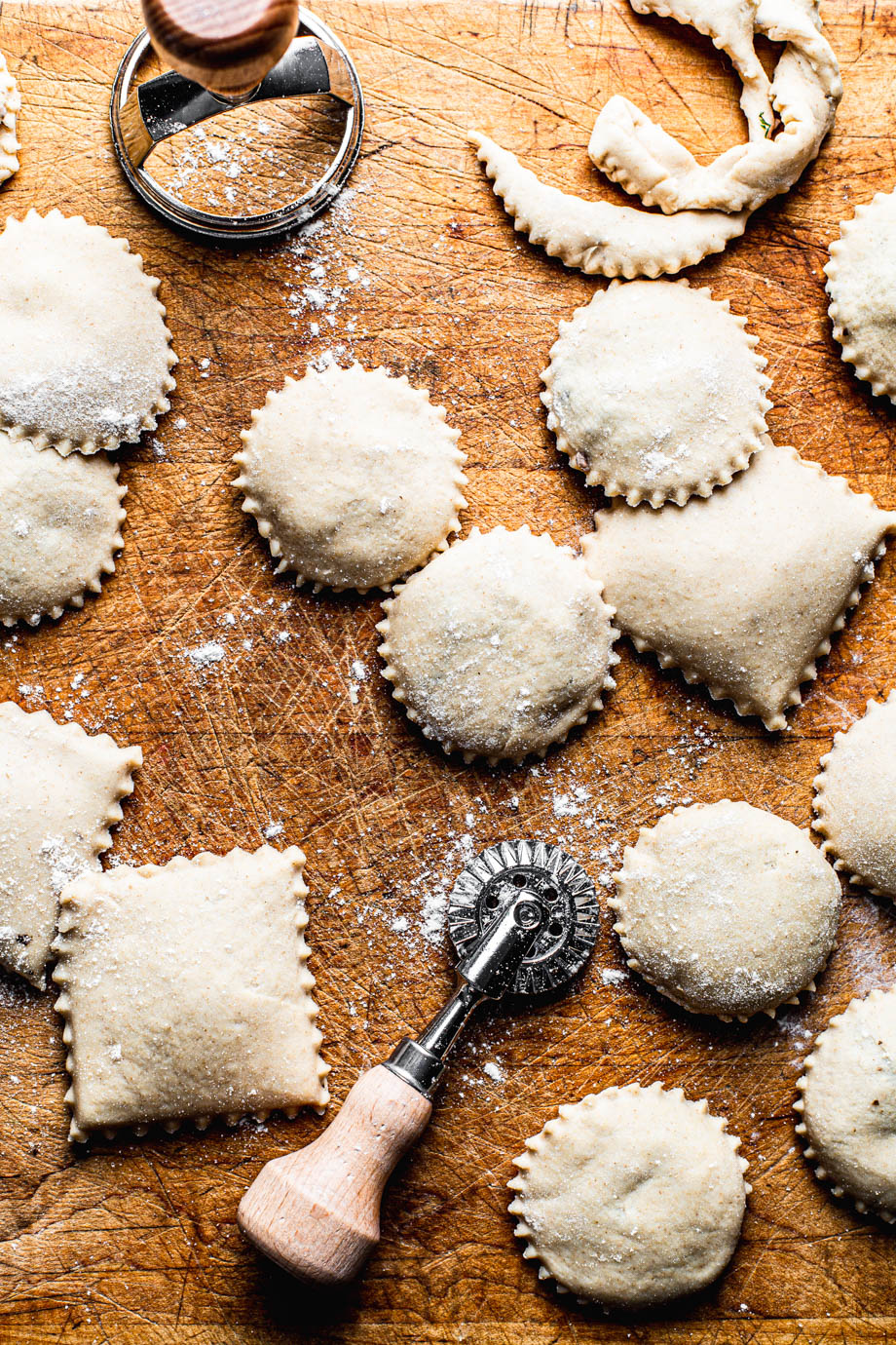 homemade ravioli on a wooden cutting board photography
