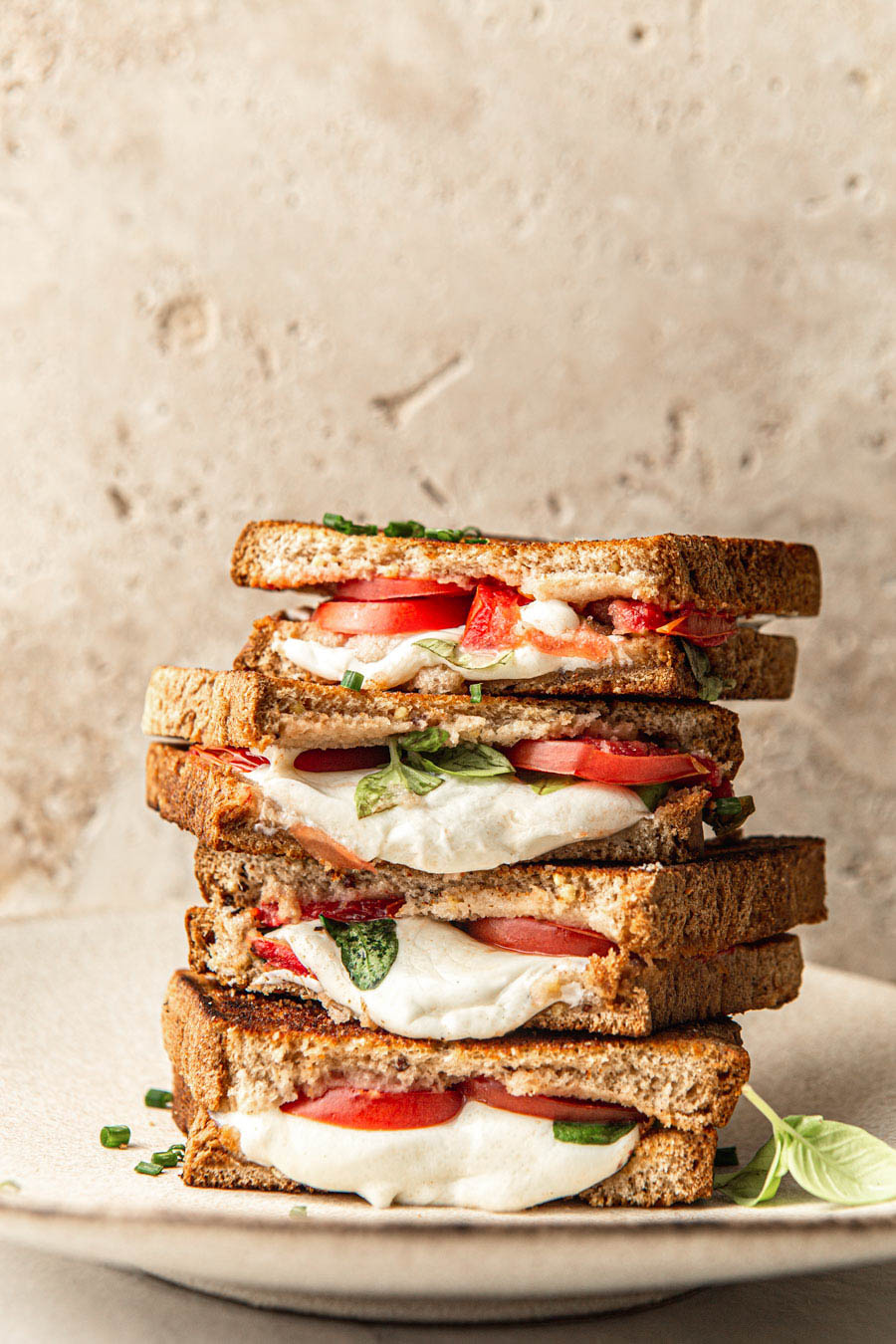 grilled cheese with mozzarella tomato and basil food styling