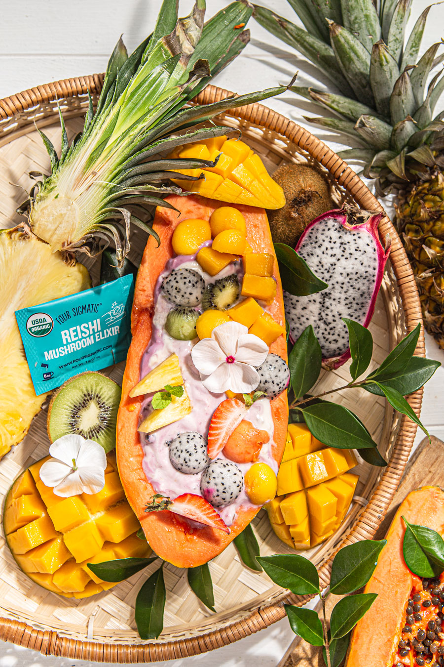 tropical papaya smoothie bowl with tropical fruits food styling