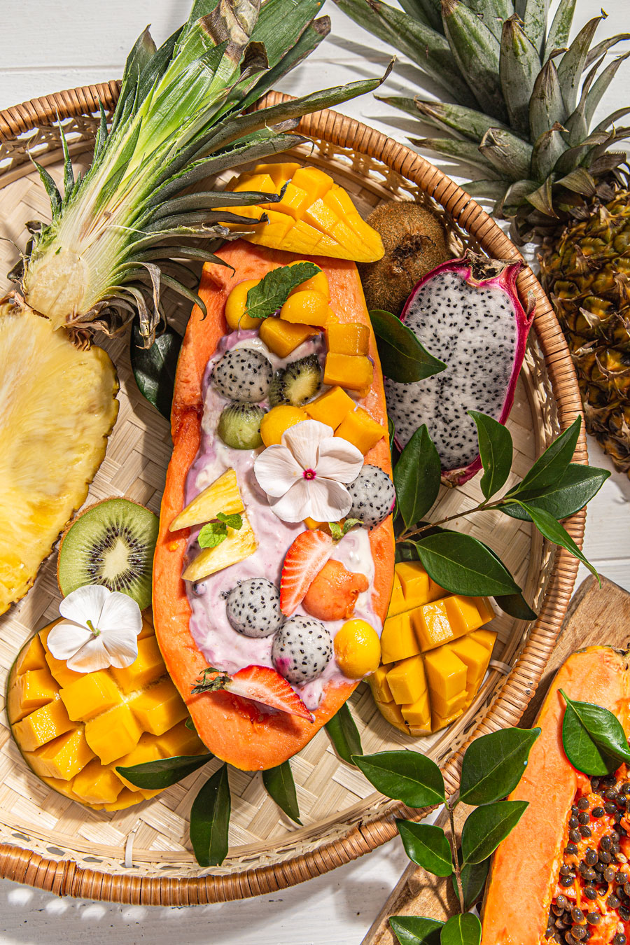 Tropical Smoothie Bowl papaya smoothie bowl on a tray food photography
