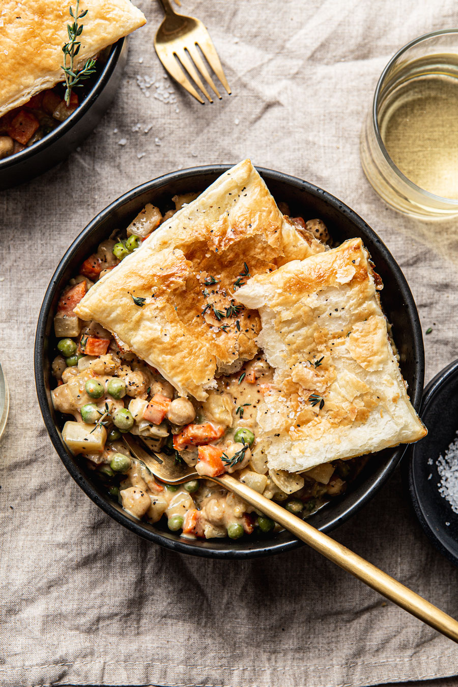 vegan chickpea pot pie topped with puff pastry photography
