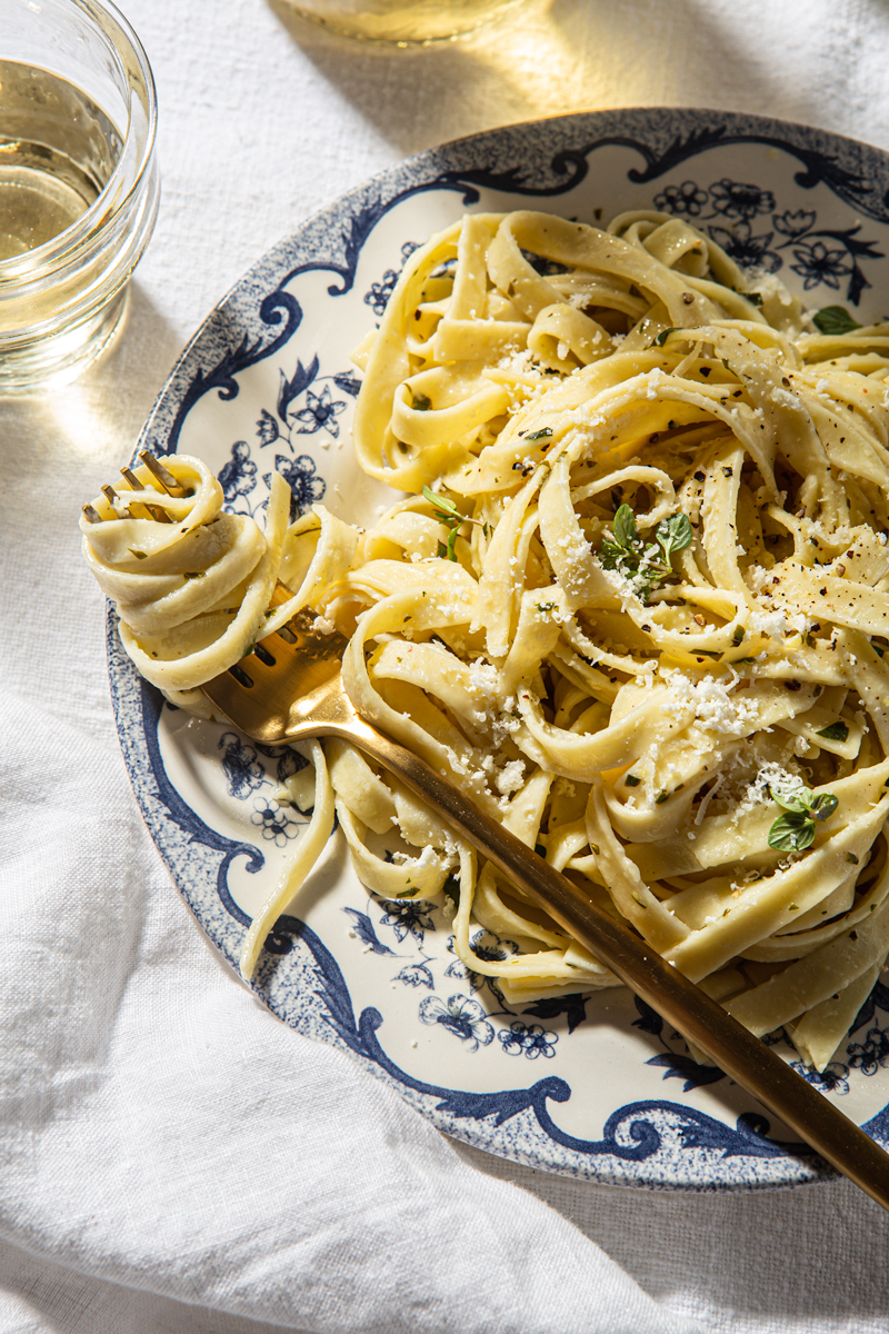lemon fettuccine pasta swirled around the fork food photography