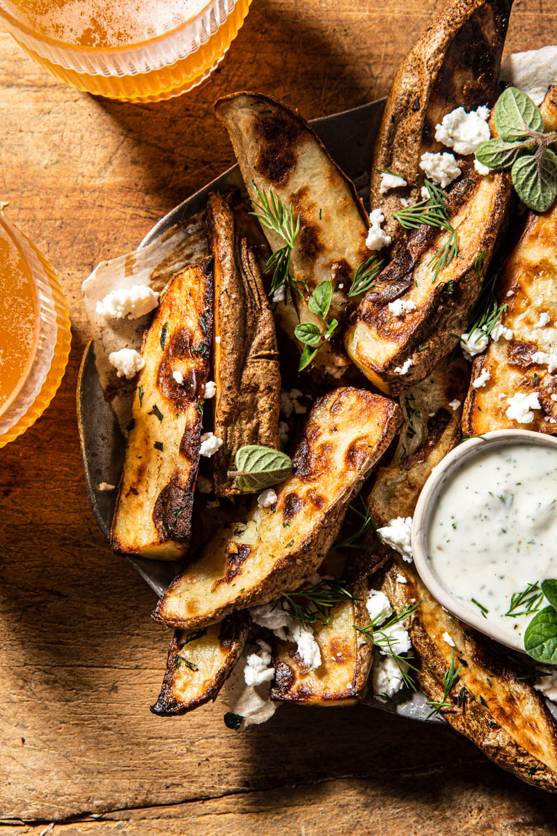 baked greek fries with yogurt dill sauce and feta
