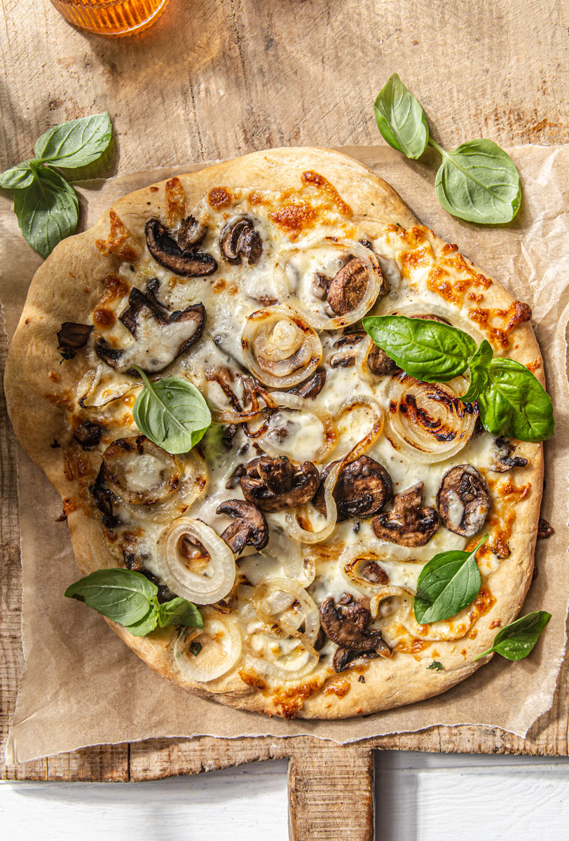 Grilled Mushroom Onion White Pizza with fresh basil photography