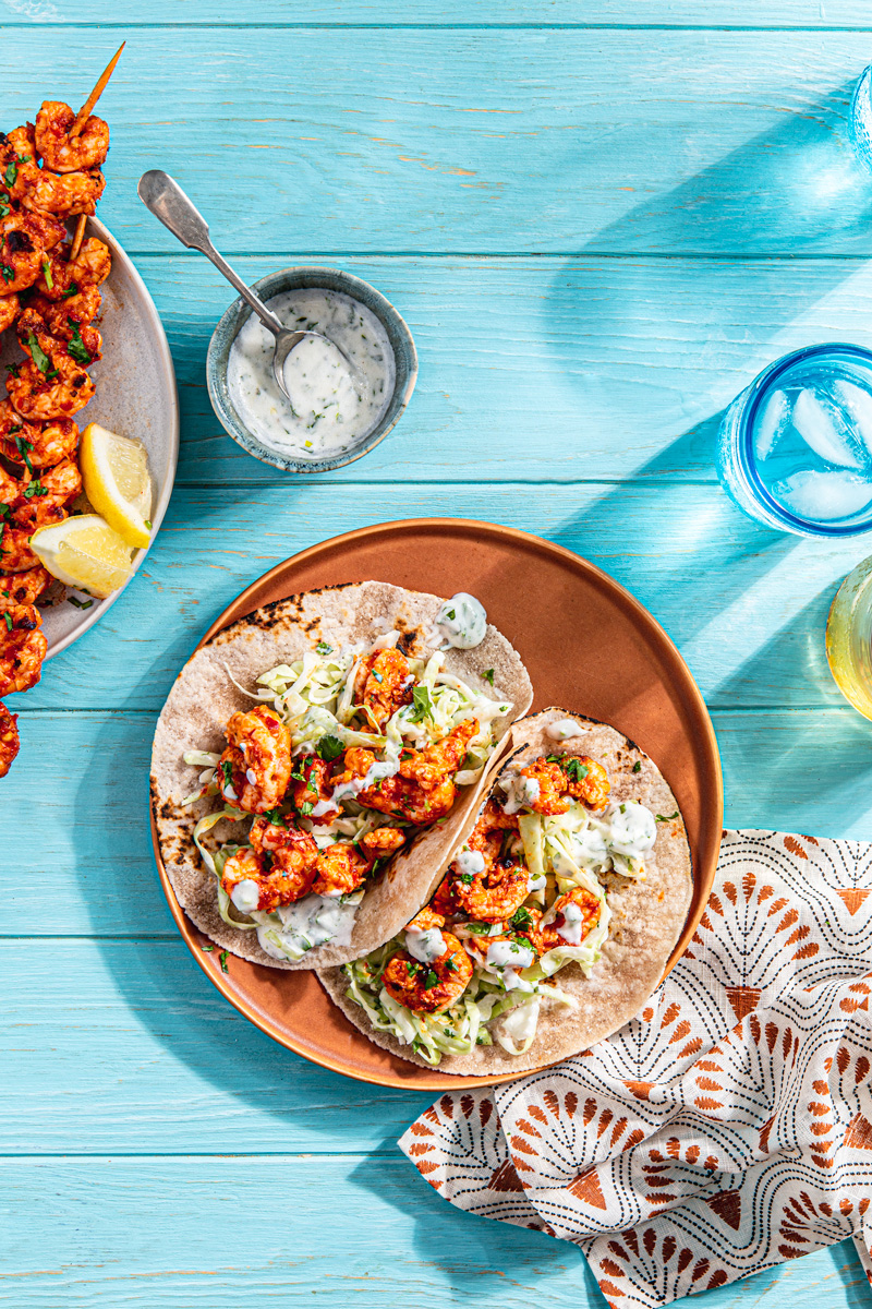 spicy shrimp tacos with harissa paste and cabbage slaw food photography