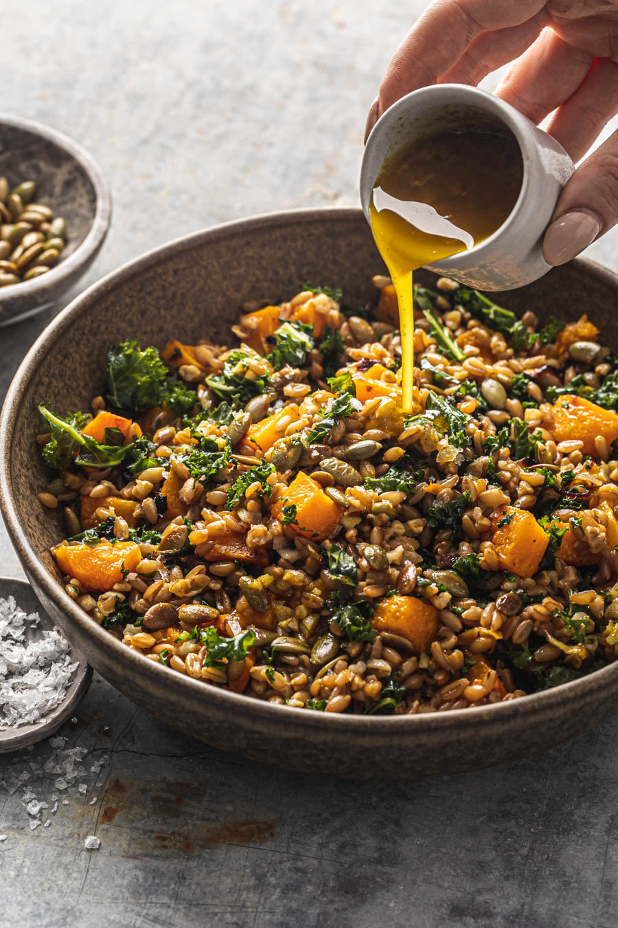 fall farro salad with kale butternut squash and curry dressing food photography