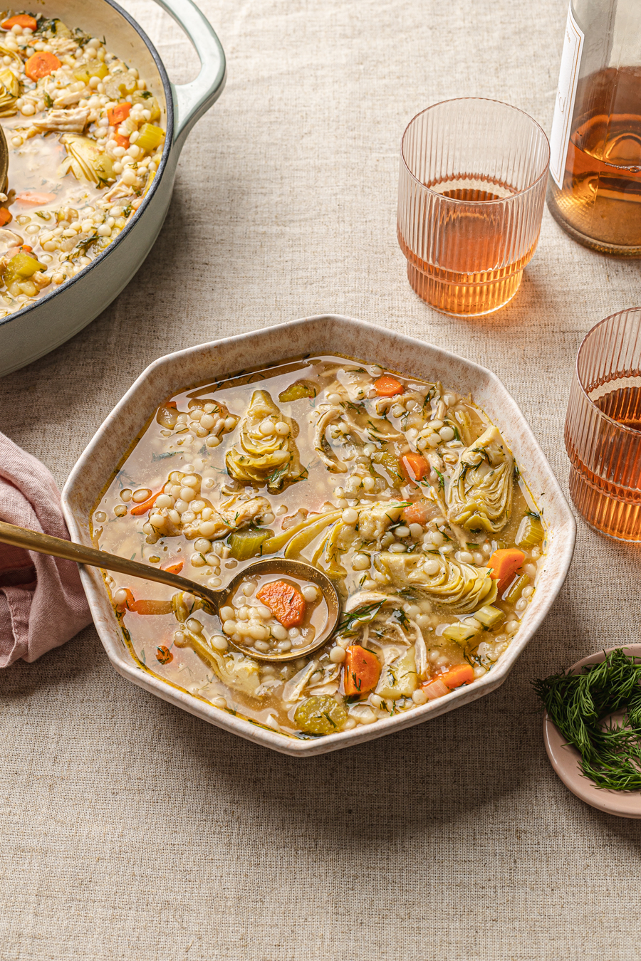 artichoke soup with chicken and couscous in anthropologie bowl food photography