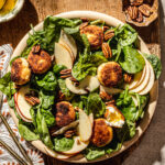 warm goat cheese salad with spinach walnuts food photography