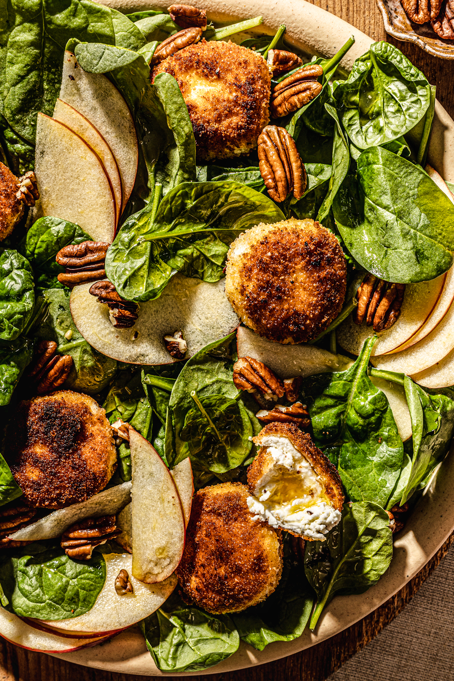 crispy goat cheese salad with spinach food photography
