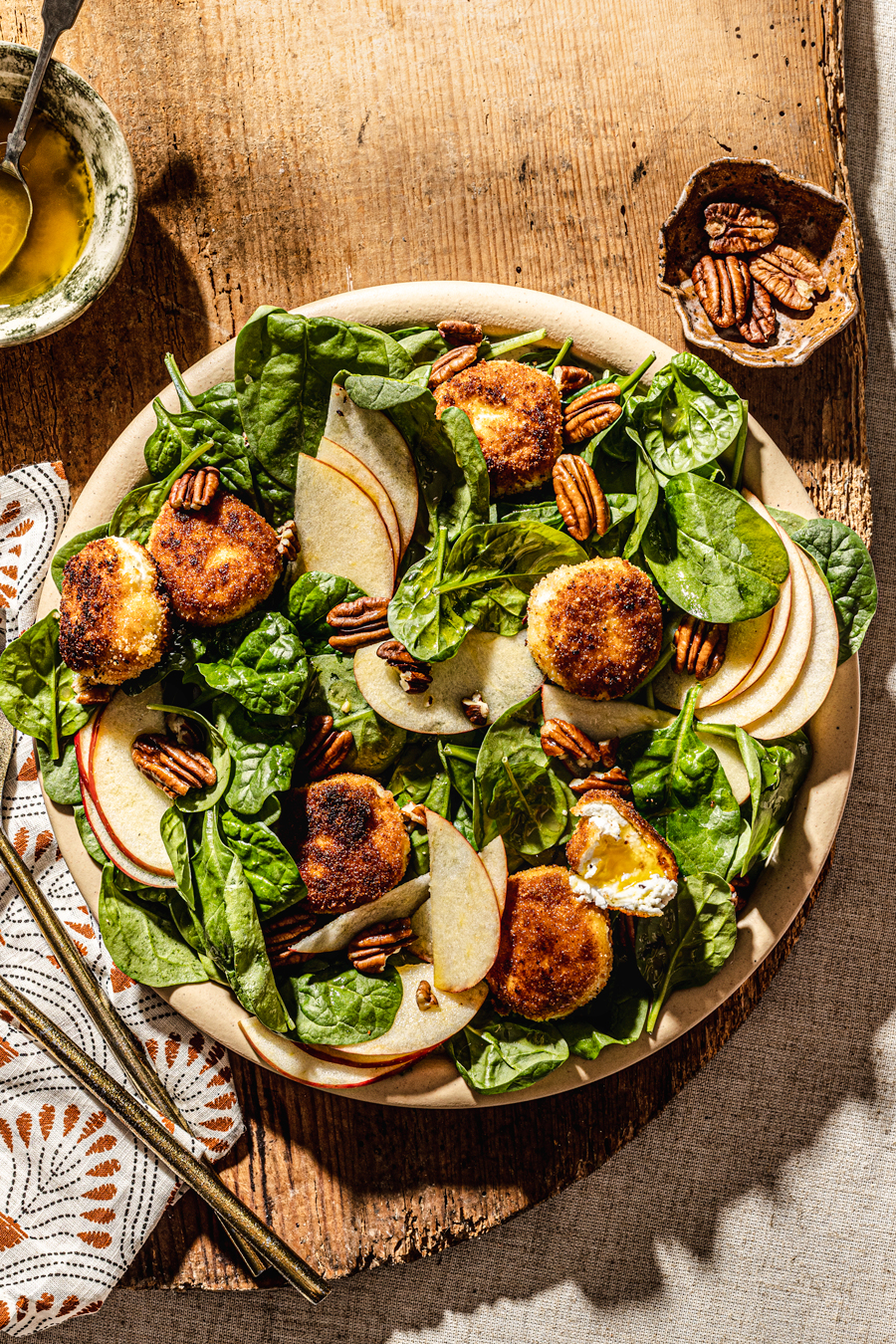 warm goat cheese salad with spinach walnuts apples and apple cider dressing