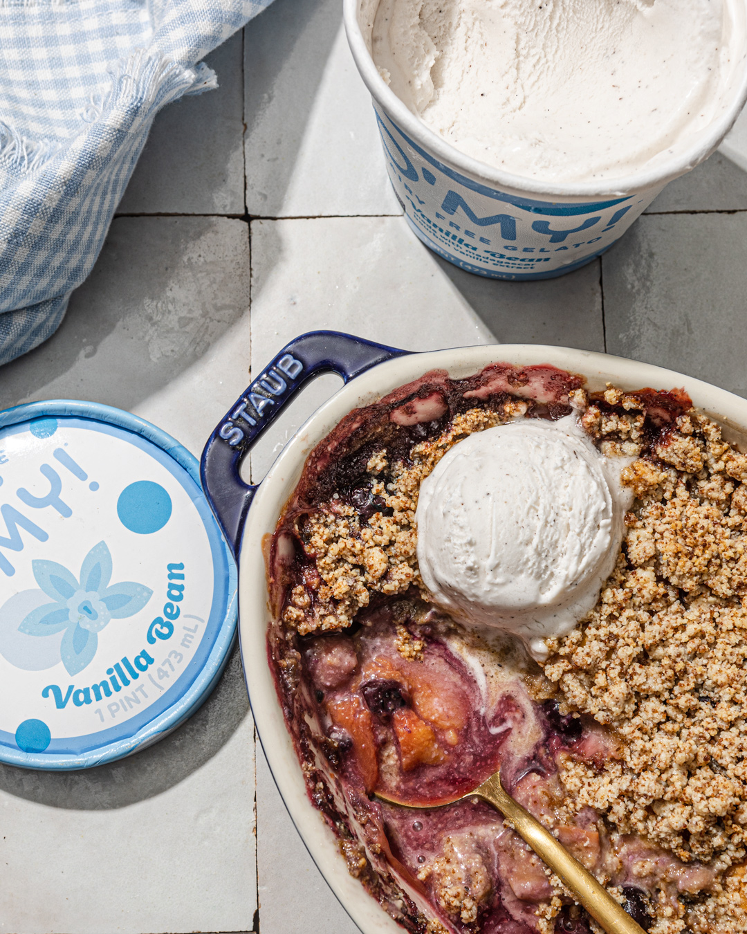 berry and peach crisp with ice cream photography